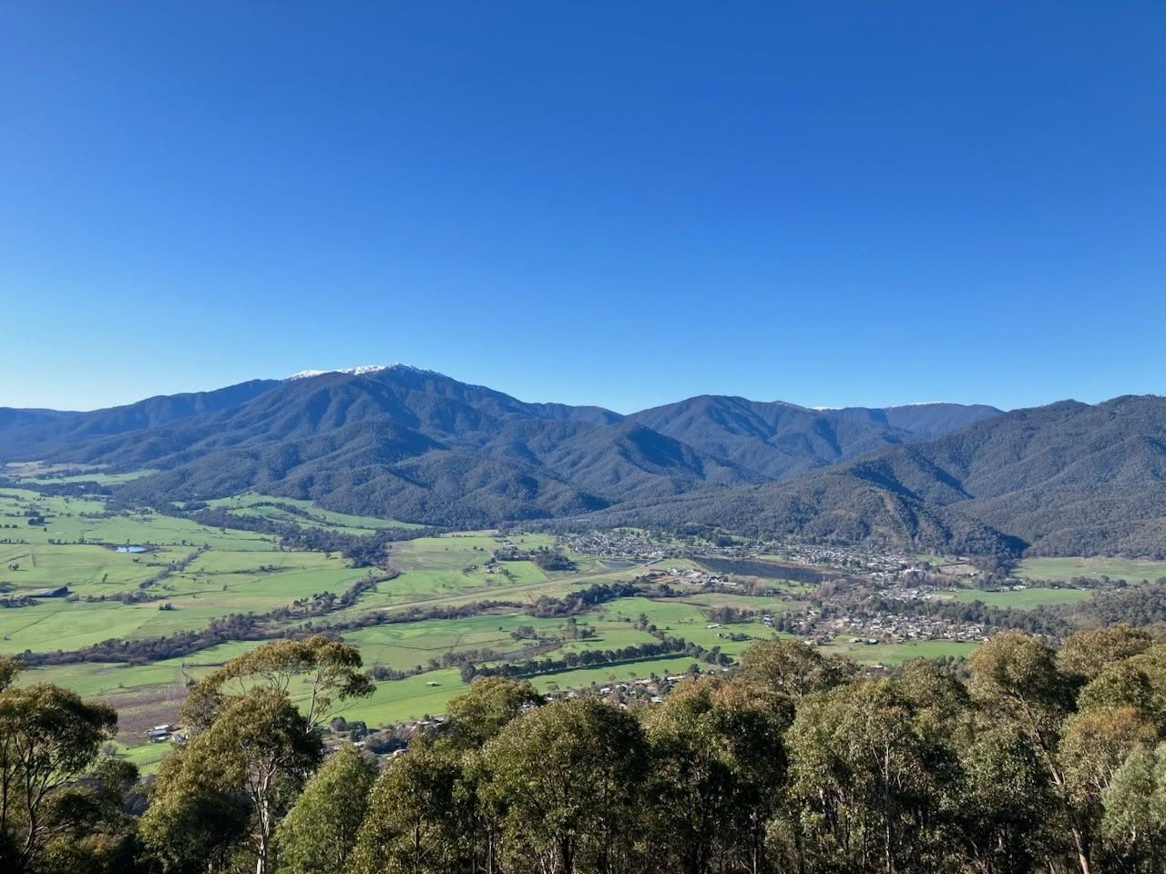 Bright and the Ovens Valley from above, with snow on the ranges